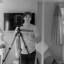 Josh Empson posing with a camera